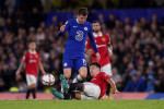 Chelsea's Mason Mount (left) and Manchester United's Lisandro Martinez battle for the ball during the Premier League match at Stamford Bridge, London. Picture date: Saturday October 22, 2022.