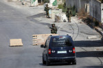Israeli forces close the northern entrance of the Palestinian city of Hebron in the West Bank Israeli forces close the n