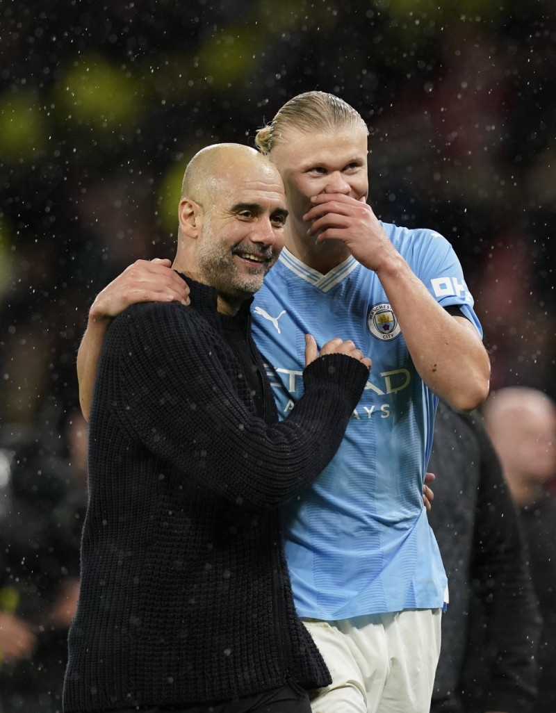 Manchester, England, 29th October 2023. Josep Guardiola coach of Manchester City laughs with Erling Haaland of Mancheste