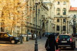 Woman walking in the morning on the cobblestones of the narrow streets of Bucharest, Romania, 2020