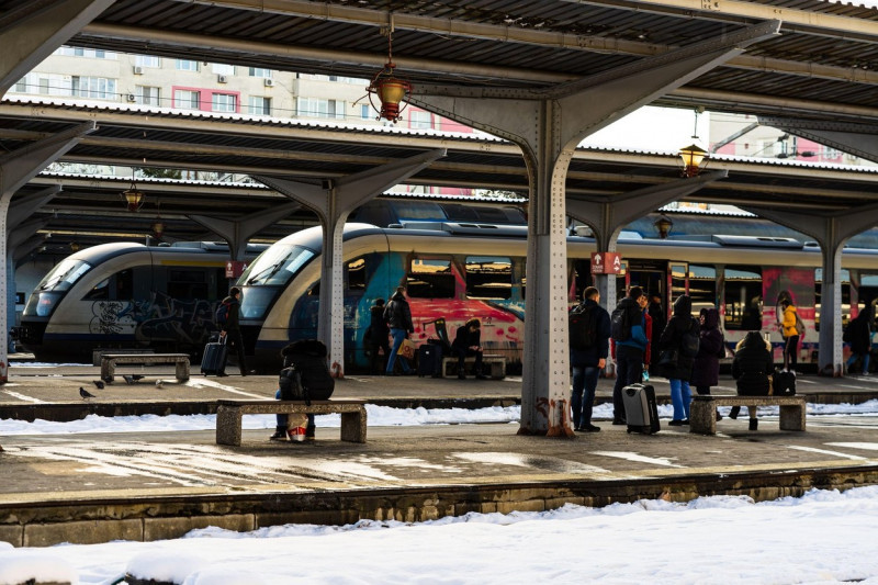 Travelers and commuters waiting for a train on the platform of Bucharest North Railway Station (Gara de Nord) in Bucharest, Romania, 2020