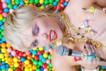 Miley Cyrus gets completely naked and rolls around in candy in the music video for her new single Midnight Sky