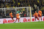 Dusan Tadic of Fenerbahce and Goalkeeper Fernando Musleraof Galatasaray during the Turkish Super League Derby match betw
