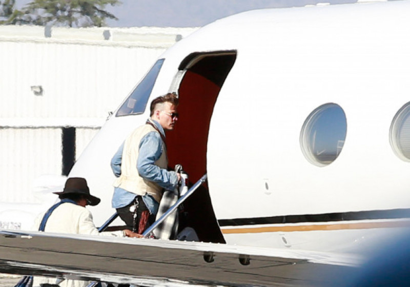 EXCLUSIVE: *****PREMIUM EXCLUSIVE RATES APPLY****   Johnny Depp seen catching a private plane out of Los Angeles with his dogs as his divorce from Amber Heard heats up.