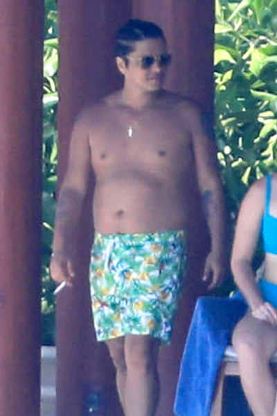 *EXCLUSIVE* Bruno Mars looks to have packed on the pounds while on vacation with girlfriend Jessica Caban