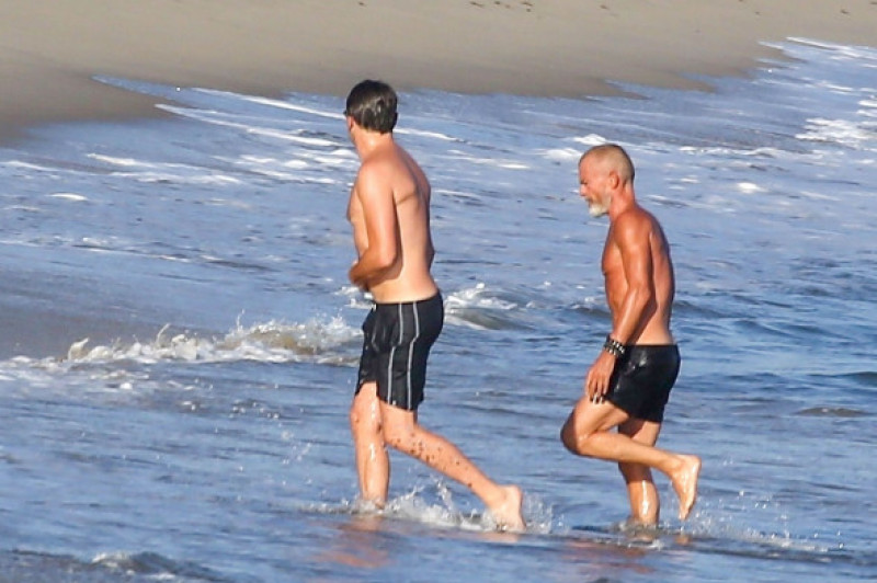 Leonardo Dicaprio appears self-conscious when spotted shirtless in Malibu