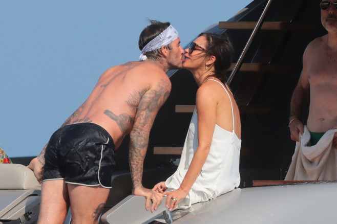 David and Victoria Beckham with Elton John