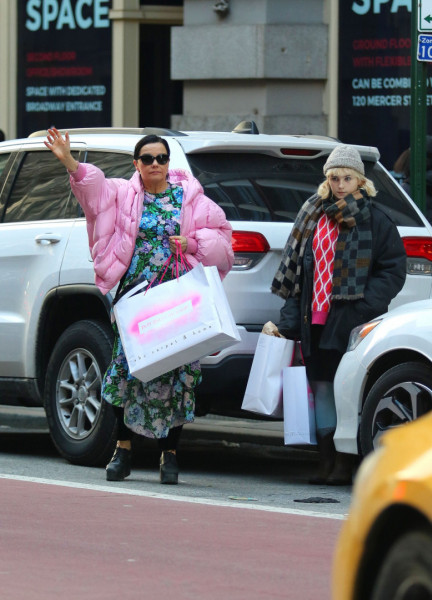 Bjork and her daughter Isadora make a rare public appearance while hailing a cab after shopping in NYC