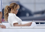 Love sick?? Jennifer Lopez can't put her phone away as she is seen texting and face timing after Ben heads back to the U.S. and she continues her vacay in Portofino!