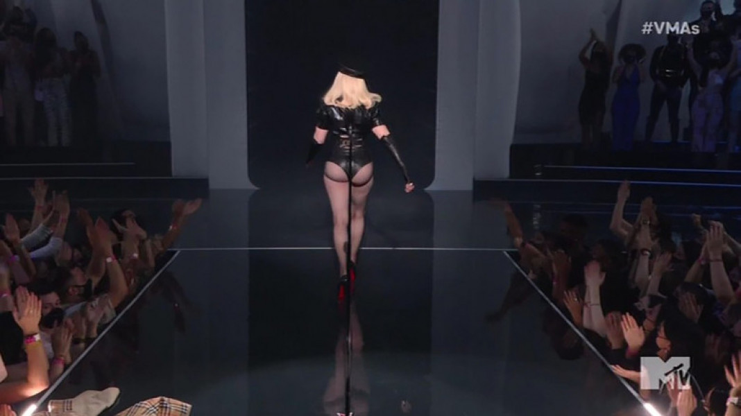Madonna makes a surprise appearance in a raunchy leather outfit to kick off the MTV Video Music Awards