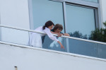 Rolling Stones enjoy their day off taking in the late afternoon views from their Miami Beach balcony.