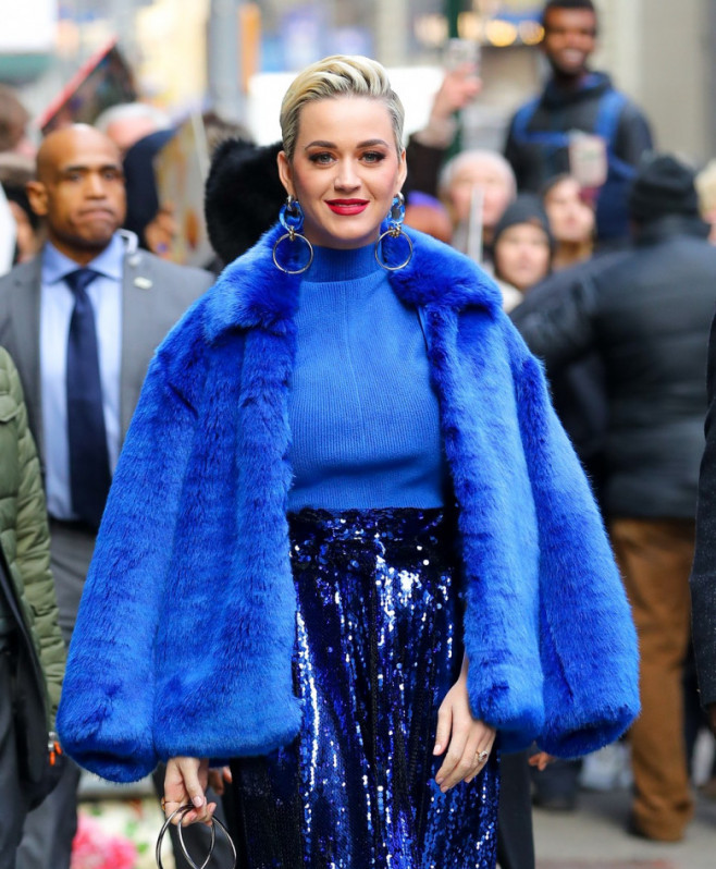 Katy Perry is all smiling while showing her engagement ring as leaving Good Morning America in New York City