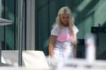 EXCLUSIVE: Christina Aguilera gets balloons and flowers as she spends Valentine's Day by the pool with her family in Miami