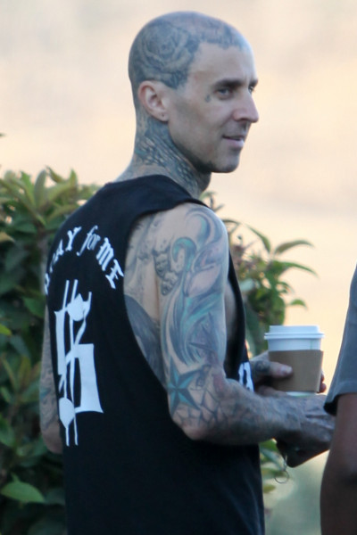 EXCLUSIVE: Travis Barker grabs coffee and getting into another G-Wagon