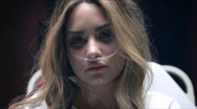 Demi Lovato recreates her overdose in Dancing With the Devil video