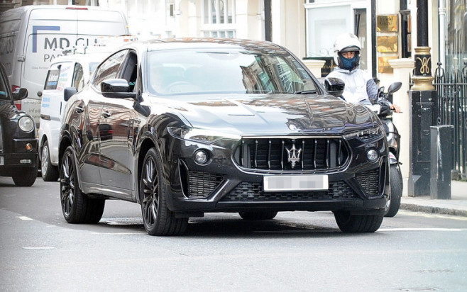 Romeo Beckham out in London driving his new Maserati Levante.