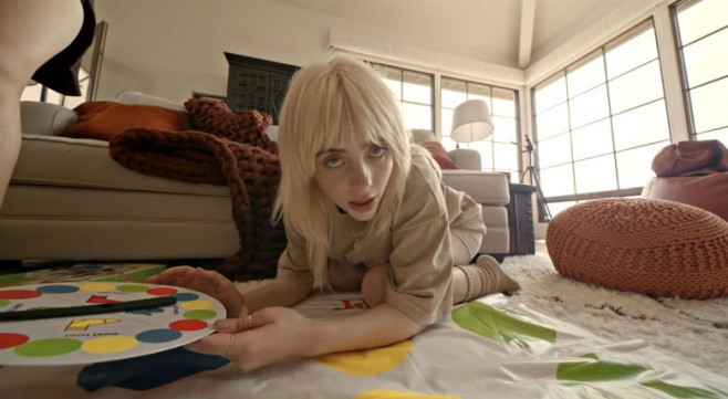 Billie Eilish shows off her stunning figure as she cavorts in bed with her girlfriends in latest music video