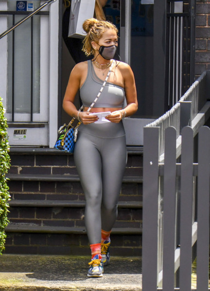 EXCLUSIVE: *NO DAILYMAIL ONLINE* Rita Ora Shows Off Her Fit Physique In A One-Shouldered Grey Active Wear Ensemble, Teamed With A Colourful Louis Vuitton Handbag, Tie-Dye Socks And Sneakers *NO UK*