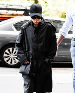 Lady Gaga seen wearing a black trench coat before her concert in New York City