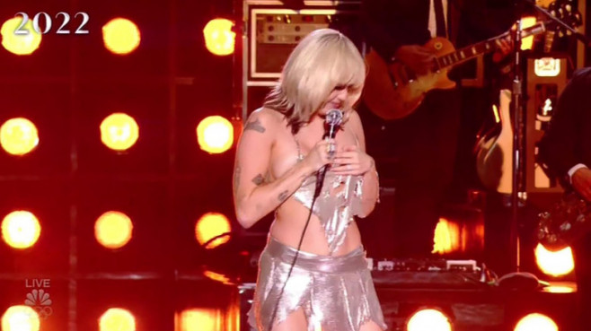 Miley Cyrus has a major wardrobe malfunction and almost exposes her boob as she performs on stage at her NBC special Miley Cyrus' New Year's Eve Party