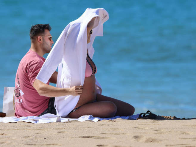 PREMIUM EXCLUSIVE: Britney Spears is seen wearing a pink and black bikini before covering up in a bath robe while on vacation with her boyfriend Sam Asghari