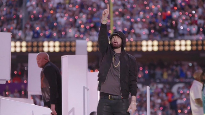 Eminem kneels during his performance while 50 Cent joins hip hop stars Dr Dre, Snoop Dogg, Mary J Blige, and Kendrick Lamar in surprise appearance at the Super Bowl LVI Half Time Show
