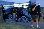 EXCLUSIVE: Elton John Arriving At Leipzig Airport In A Wheelchair After His Show In A Blue Jogging Suit