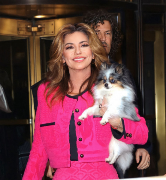 Singer Shania Twain seen wearing all pink and carrying her dog as she leaves The Today Show