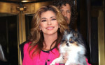 Singer Shania Twain seen wearing all pink and carrying her dog as she leaves The Today Show
