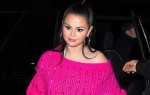 Selena Gomez is pretty in pink as she arrives at the SNL after party