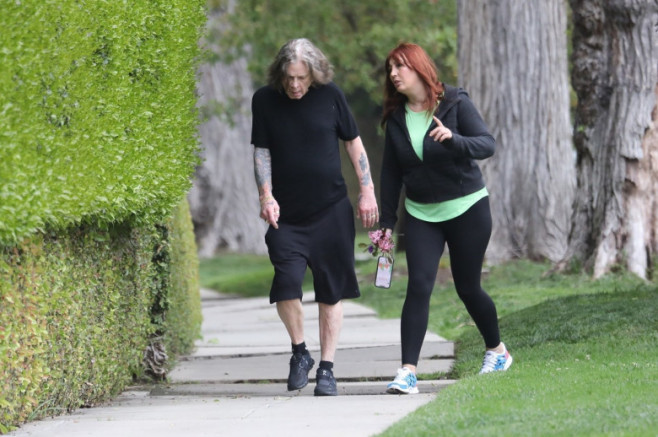 *EXOzzy Osbourne/ ProfimediaCLUSIVE* Ozzy Osbourne out for a walk with his caretaker **WEB MUST CALL*