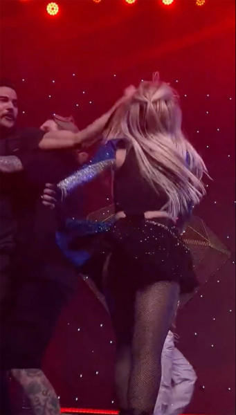 Ava Max is slapped in the face by a fan while performing onstage during her concert in Los Angeles, CA.