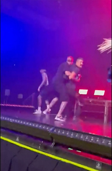 Ava Max fan hauled off stage after appearing to slap the singer during her concert in Los Angeles, CA.