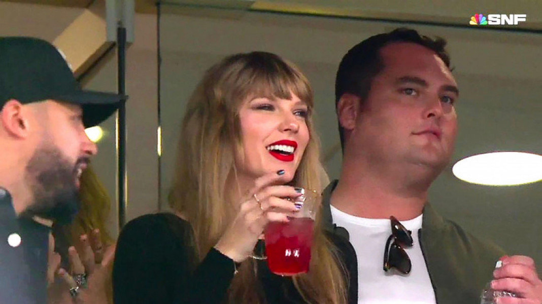 Taylor Swift hangs out in the VIP box with a drink waiting for boyfriend Travis Kelce’s NFL game to start