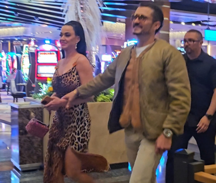 EXCLUSIVE: Katy Perry Stuns In All Cheetah Dress As She Holds Hands With Husband Orlando Bloom On Date Night In Las Vegas