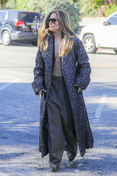 Jennifer Lopez playing with cleavage in Beverly Hills