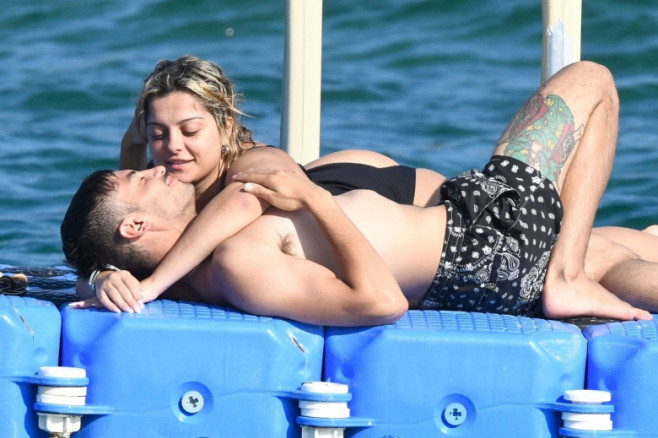 *PREMIUM-EXCLUSIVE* MUST CALL FOR PRICING BEFORE USAGE  - The American Singer Bebe Rexha packs on PDA with her new boyfriend, the Architectural Engineer Simos Liakos as the pair took to the waters with a passionate display during their sun-soaked holiday