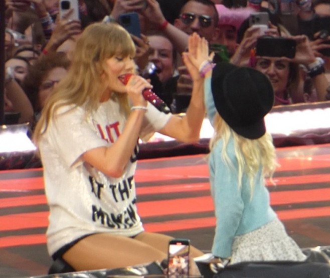 Taylor Swift Gifts Hat To Young Fan During Eras Tour At Wembley Stadium - 15 Aug 2024