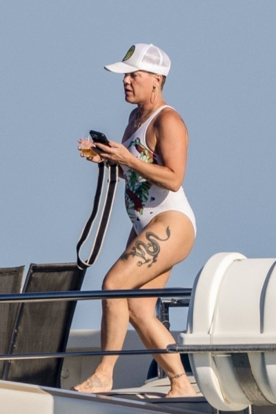 *EXCLUSIVE* Pink enjoys a drink and some sun during family vacation in Cabo before kicking off tour again - ** WEB MUST CALL FOR PRICING **