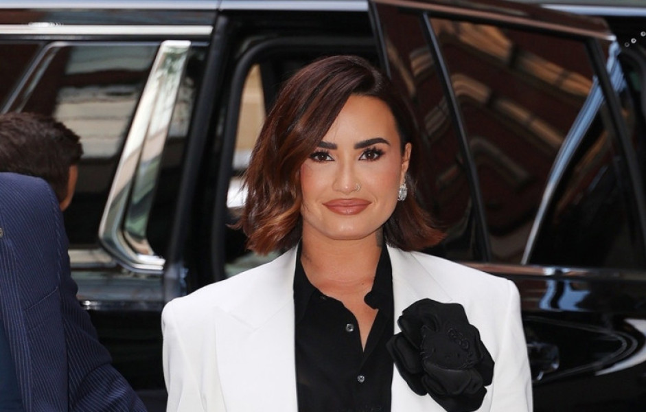 Demi Lovato stuns at Vogue dinner party with chic black and white outfit and Hello Kitty flower