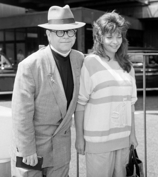 Rock singer Elton John and wife Ranate Blauel arriving at  London's Heathrow Airport August 1988.