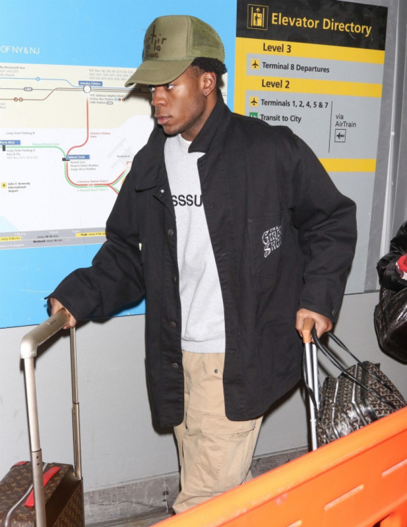 'ICON' Madonna with son David and daughter Estere arrive back home at JFK airport in NYC