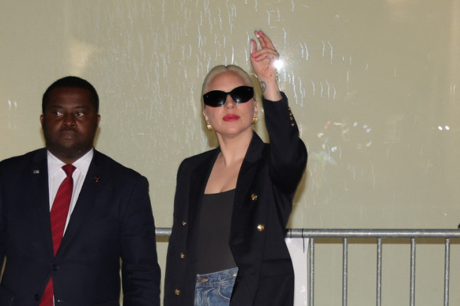 Lady Gaga returns to her hotel around 1 a.m. wearing high heels and white paint on her fingers