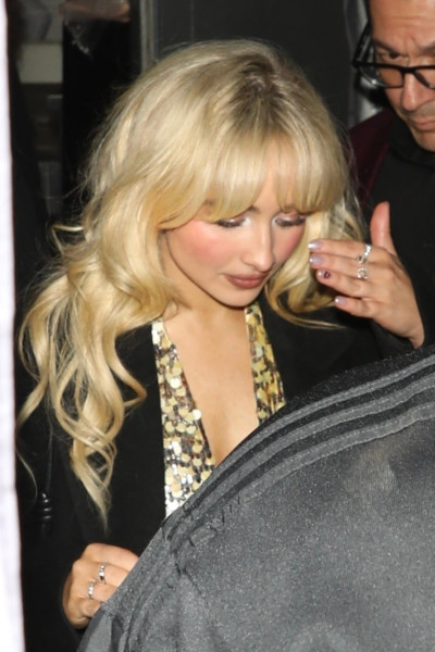 *EXCLUSIVE* Sabrina Carpenter leaves after-party in gold dress after sold-out Kia Forum shows