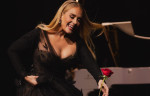 Adele wears a dress by Russian designer