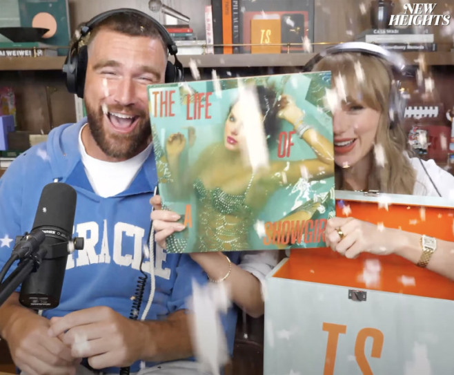 Taylor Swift gets a mouthful of confetti while announcing her upcoming “The Life of a Showgirl” album during an appearance on boyfriend Travis Kelce’s “New Heights” podcast