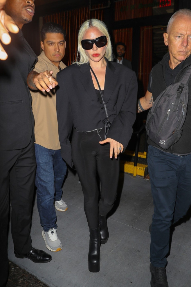 Lady Gaga shows her engagement ring while leaving the Corner Store with fiancé Michael Polansky in NYC
