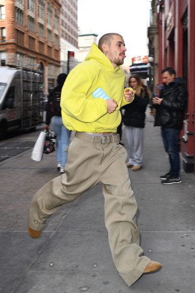 Justin Bieber Runs into a Studio in New York City