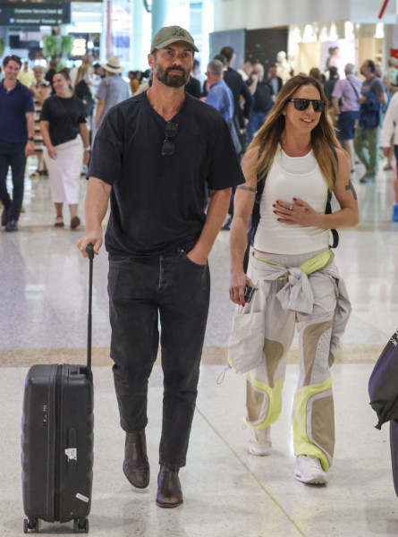 Airport PDA! Mel C and her Aussie boyfriend Chris Dingwall hold hands as they return from their trip to Melbourne, with the couple spotted together arm-in-arm at Sydney Airport.