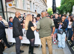 Mariah Carey stuns in chic black playsuit as she greets fans outside London Hotel